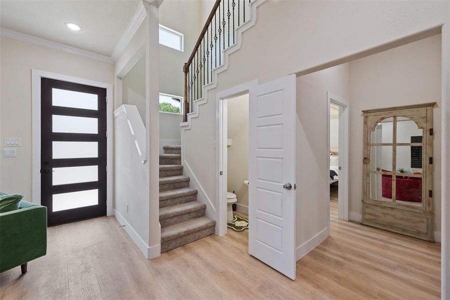 Foyer featuring half bathroom