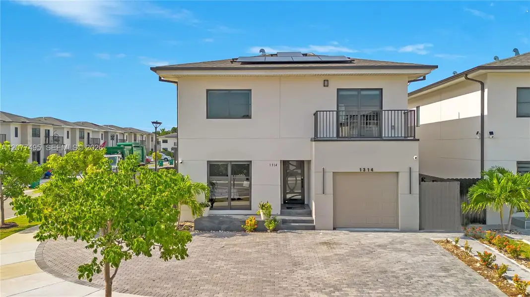 Front exterior of a new home in , Florida City, FL, highlighting curb appeal (Image 21). Front exterior of a new home in , Florida City, FL, highlighting curb appeal (Image 21).