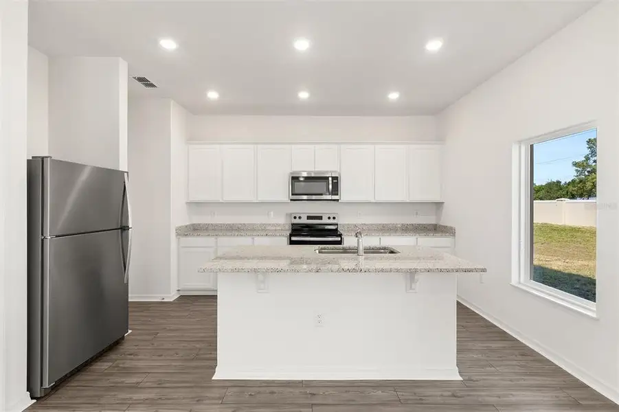 Furnished interior view inside a new home in Peach Crossings, Winter Haven (Image 6).