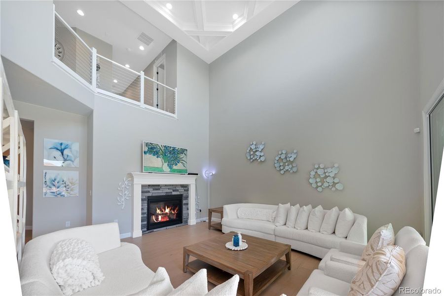 Vaulted Living Room with Fireplace and Beamed Ceilings