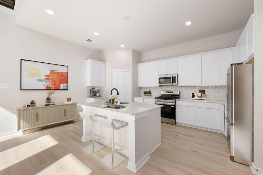 This bright and modern kitchen features sleek white cabinetry, stainless steel appliances, and a spacious island perfect for meal prep or casual dining. Clean lines and light flooring create an airy feel, making this space both stylish and functional.
