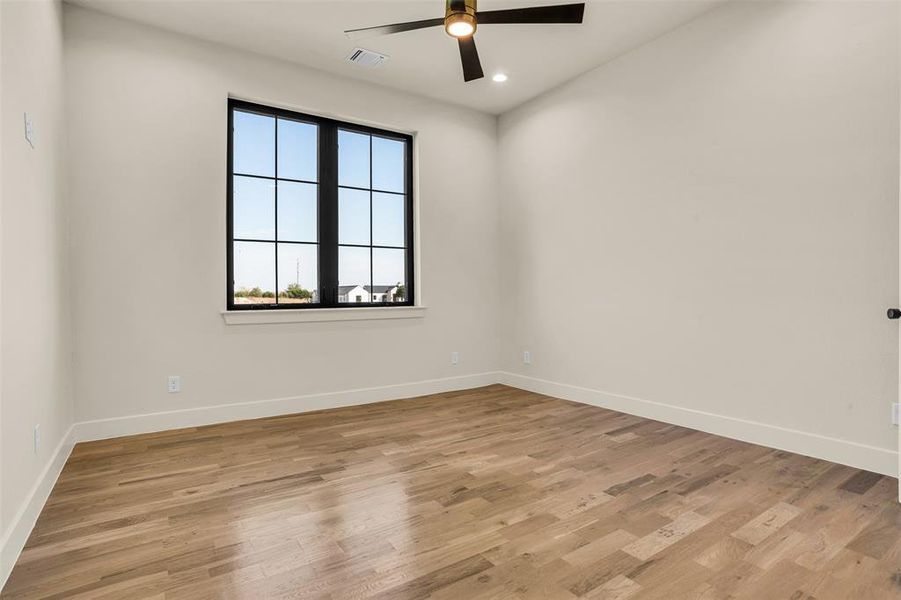 Unfurnished room featuring light wood finished floors, ceiling fan, and recessed lighting Unfurnished room featuring light wood finished floors, ceiling fan, and recessed lighting