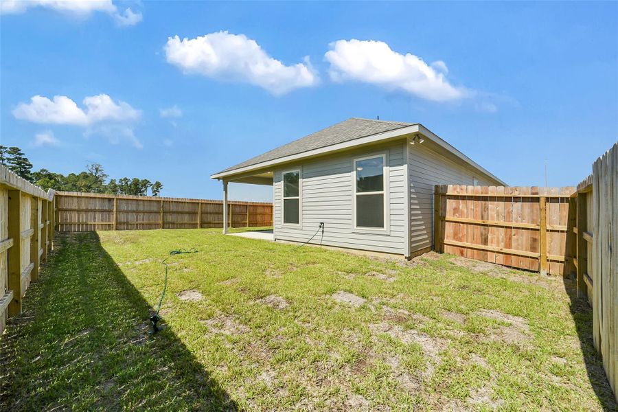 Exterior details and patio area of a home in Mostyn Springs, Magnolia (Image 19).