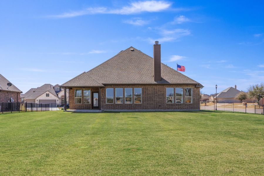 Exterior details and patio area of a home in Abe's Landing, Granbury (Image 3).