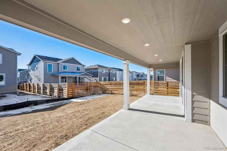 Exterior details and patio area of a home in The Aurora Highlands, Aurora (Image 3).