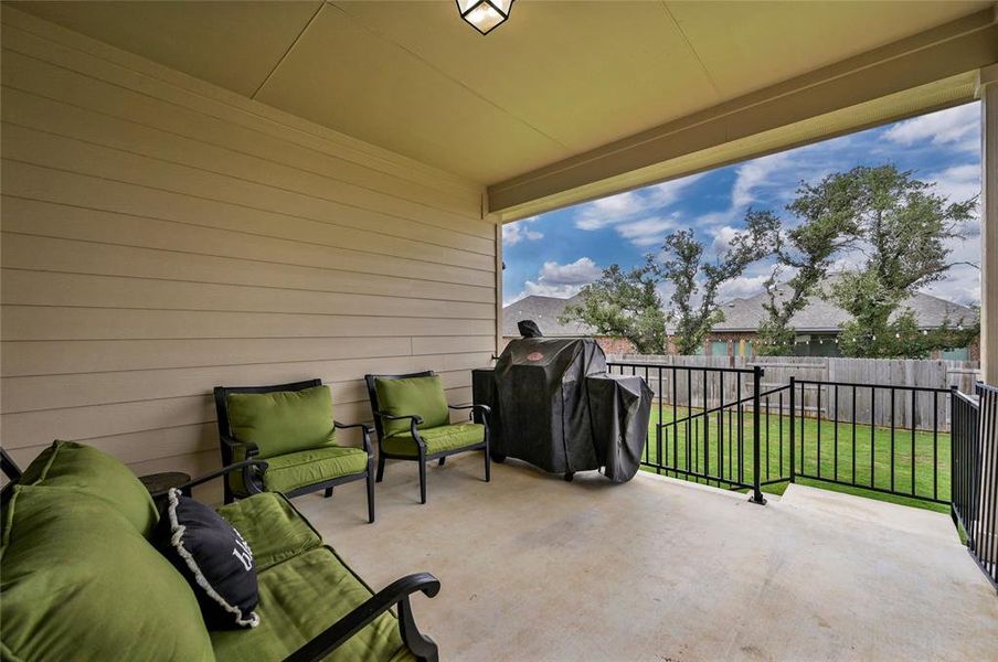 Covered back patio allows for relaxing even when it's raining.