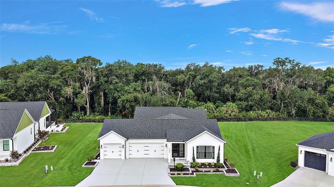 Front exterior of a new home in , The Villages, FL, highlighting curb appeal (Image 29).