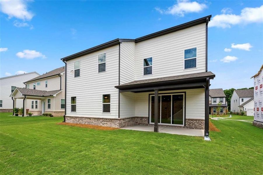 Exterior details and patio area of a home in The Paddocks at Doc Hughes, Buford (Image 3).