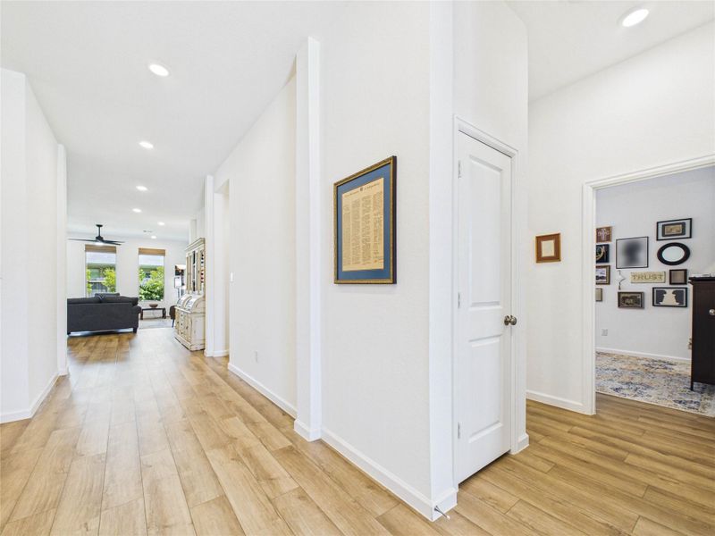 Beautiful LVP flooring runs throughout the home. Looking down the foyer from the front door you will see the hall way to the right that leads to a storage closet, 2 secondary bedrooms and a full sized bathroom.