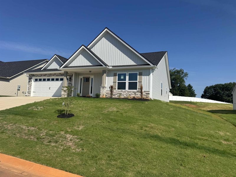Front exterior of a new home in Davis Heights, Inman, SC, highlighting curb appeal (Image 2). Front exterior of a new home in Davis Heights, Inman, SC, highlighting curb appeal (Image 2).