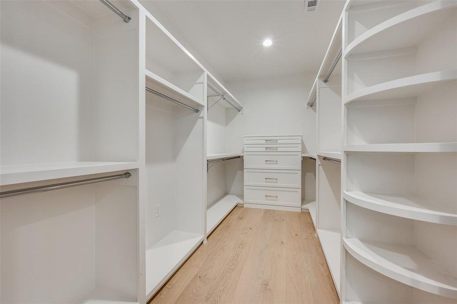 Walk in closet featuring light wood-type flooring