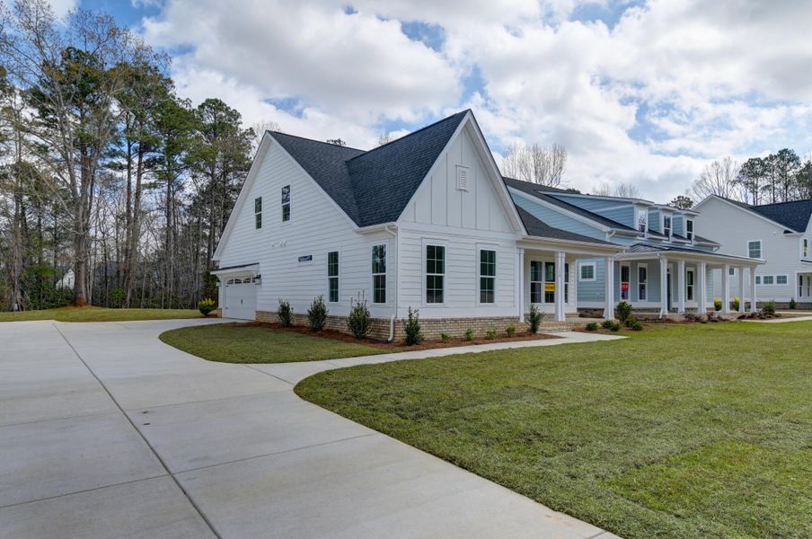 Front exterior of a new home in Clubside Reserve at Summerlake, Lexington, SC, highlighting curb appeal (Image 2). Front exterior of a new home in Clubside Reserve at Summerlake, Lexington, SC, highlighting curb appeal (Image 2).