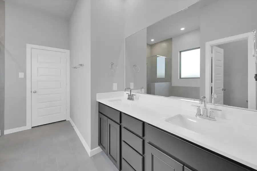 Furnished interior view inside a new home in Sunterra 40, Katy (Image 9).