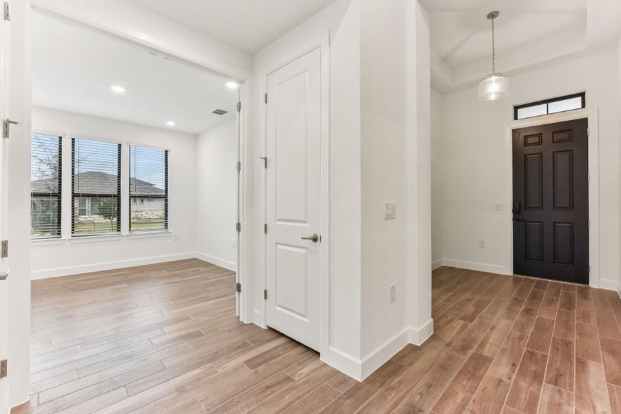 Foyer featuring light wood finished floors and recessed lighting Foyer featuring light wood finished floors and recessed lighting