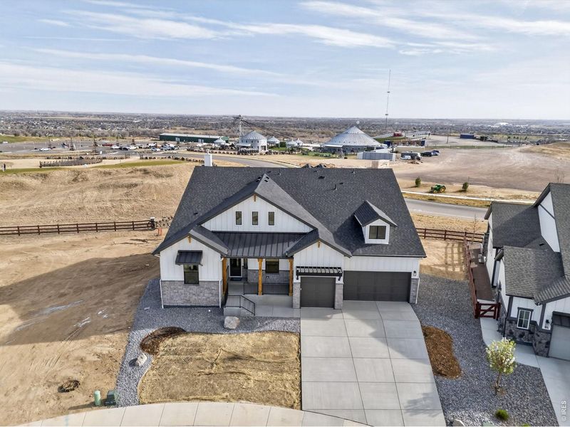 Front exterior of a new home in RainDance, Windsor, CO, highlighting curb appeal (Image 23).