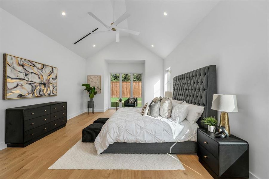 Bedroom with access to exterior, light wood-style flooring, a ceiling fan, high vaulted ceiling, and recessed lighting