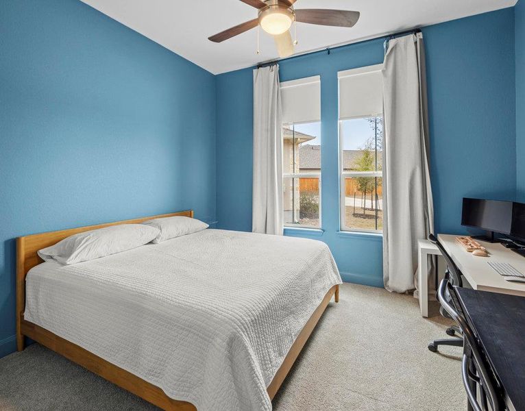 Bedroom with carpet flooring and ceiling fan