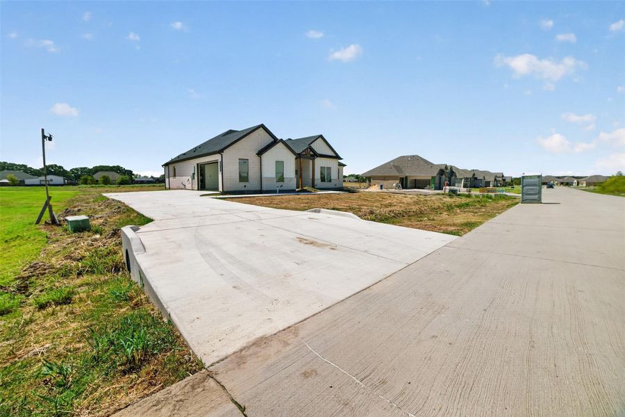 Front exterior of a new home in , Lone Oak, TX, highlighting curb appeal (Image 2). Front exterior of a new home in , Lone Oak, TX, highlighting curb appeal (Image 2).
