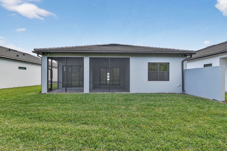 Exterior details and patio area of a home in Greyhawk Landing, Lake Worth (Image 3).
