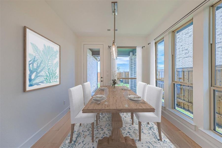 Virtually Staged Photo - Dining space featuring hardwood / wood-style floors