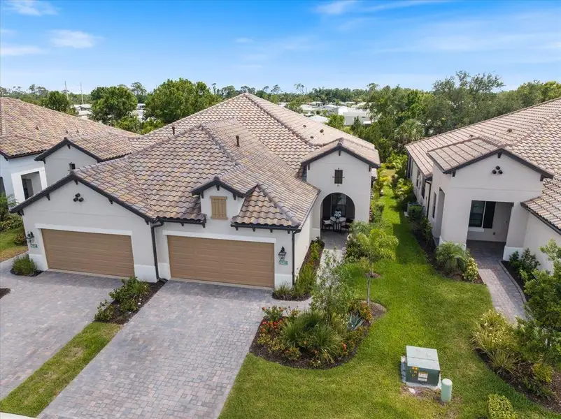 Front exterior of a new home in , Englewood, FL, highlighting curb appeal (Image 2). Front exterior of a new home in , Englewood, FL, highlighting curb appeal (Image 2).