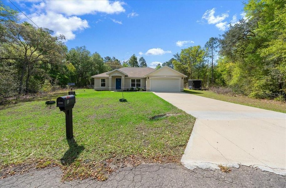 Front exterior of a new home in , Ocklawaha, FL, highlighting curb appeal (Image 2). Front exterior of a new home in , Ocklawaha, FL, highlighting curb appeal (Image 2).