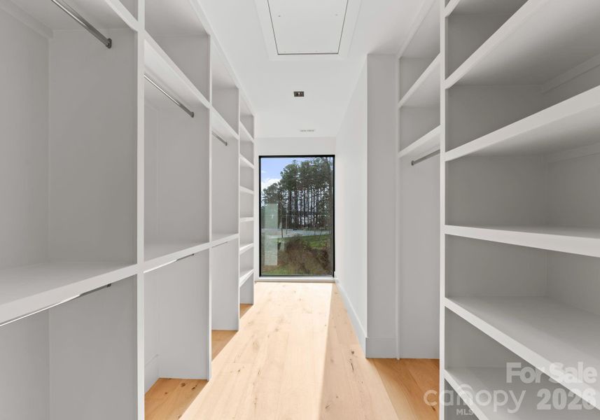 Guest suite with full bathroom and spacious walk-in closet. Guest suite with full bathroom and spacious walk-in closet.