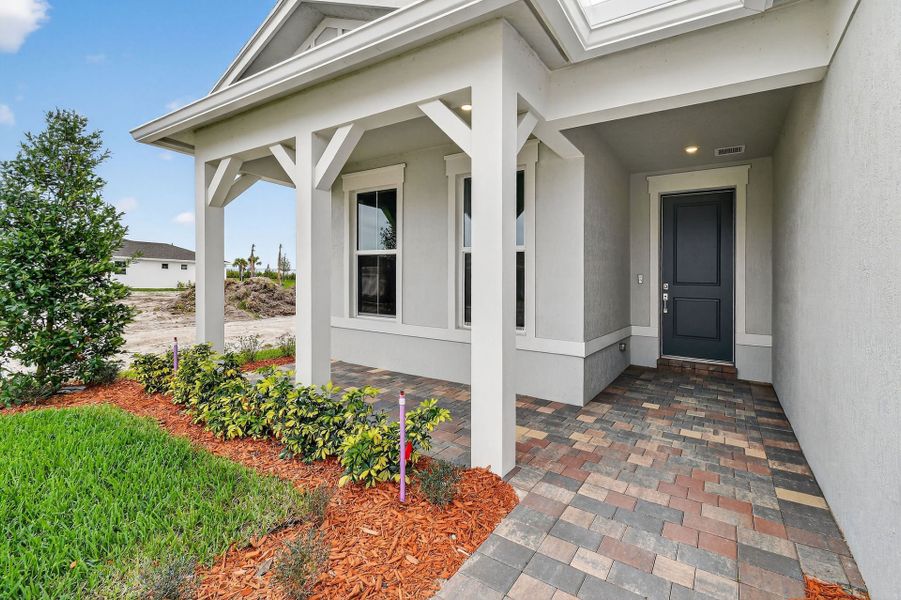 Exterior details and patio area of a home in Del Webb Tradition, Port St. Lucie (Image 3).