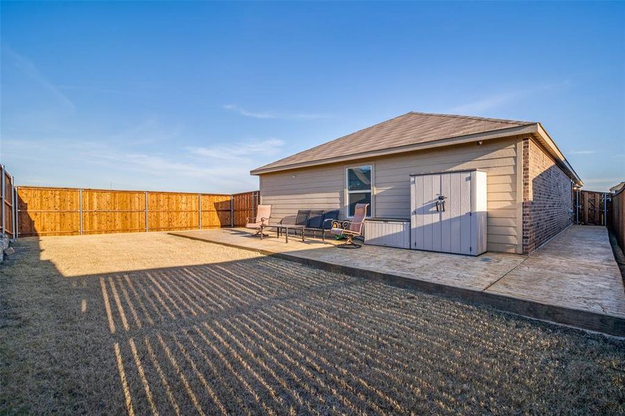 Rear view of property featuring a patio area