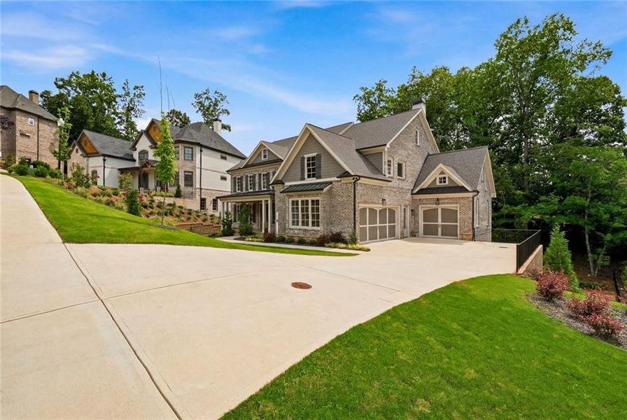 Front exterior of a new home in , Suwanee, GA, highlighting curb appeal (Image 29). Front exterior of a new home in , Suwanee, GA, highlighting curb appeal (Image 29).