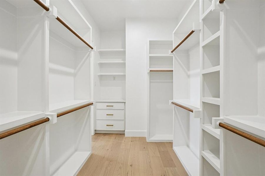 Walk in closet featuring light wood finished floors