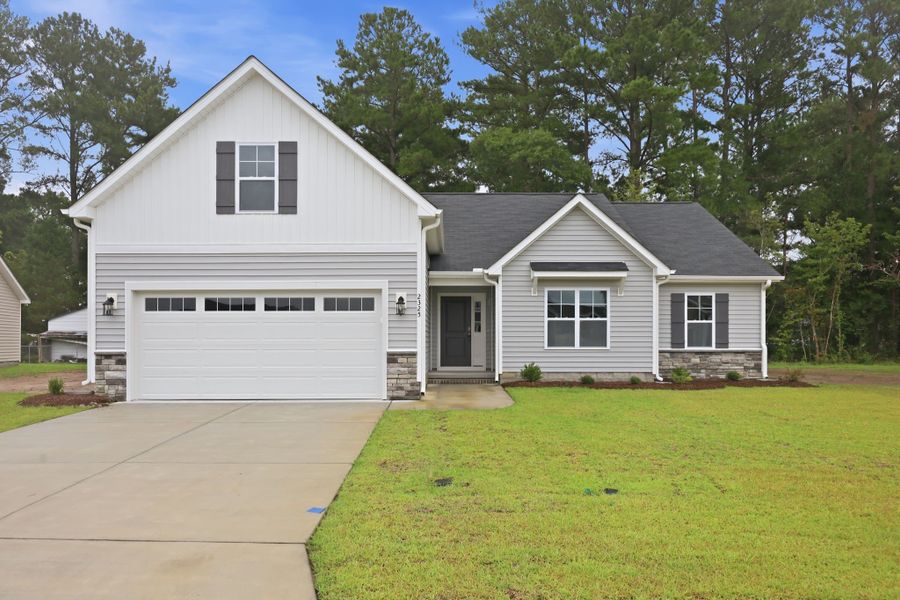 Front exterior of a new home in Davenport Farms, Winterville, NC, highlighting curb appeal (Image 2). Front exterior of a new home in Davenport Farms, Winterville, NC, highlighting curb appeal (Image 2).