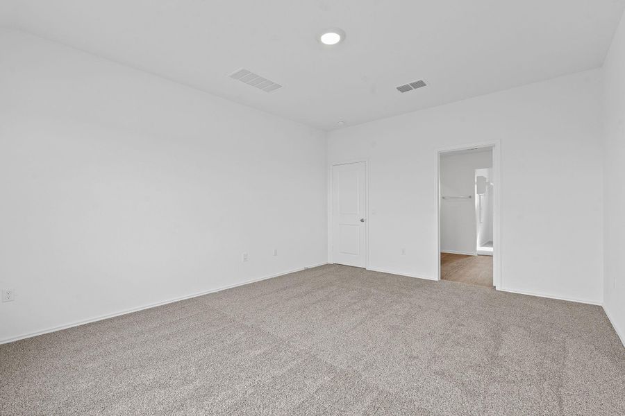 Unfurnished bedroom with carpet and baseboards Unfurnished bedroom with carpet and baseboards