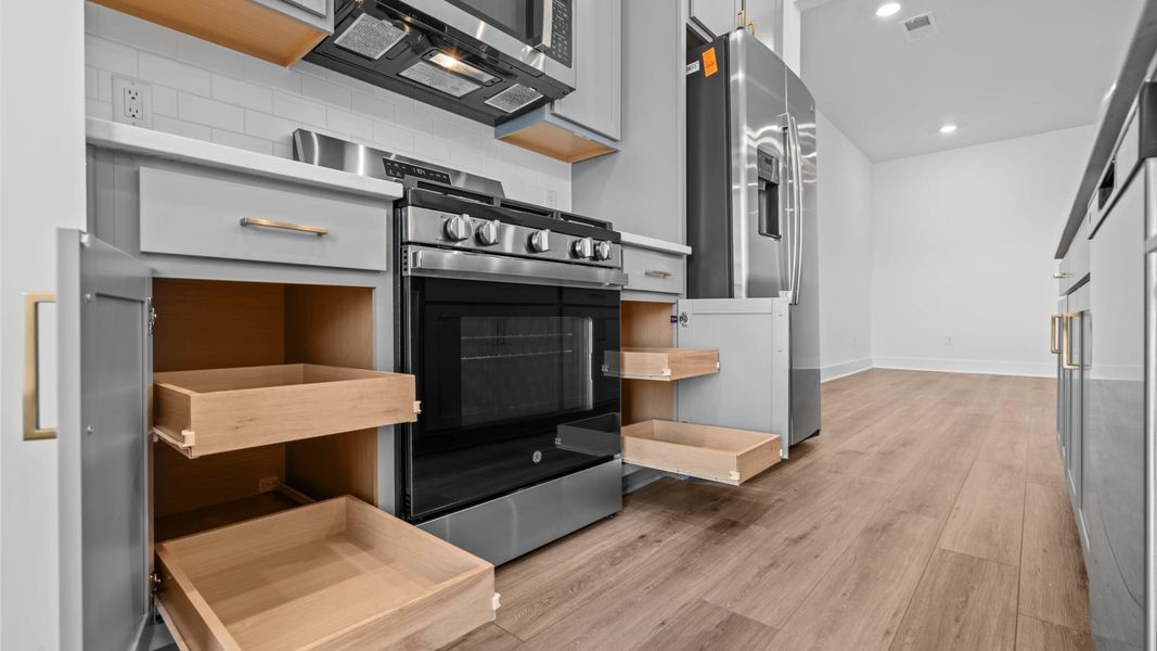 Superior craftsmanship shines in this modern kitchen with a space-saving island and open flow in Anderson, SC