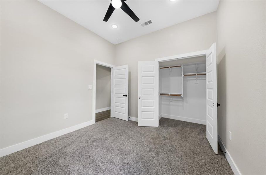 Different view of 2nd bedroom featuring carpet, a closet, a ceiling fan, and recessed lighting Different view of 2nd bedroom featuring carpet, a closet, a ceiling fan, and recessed lighting