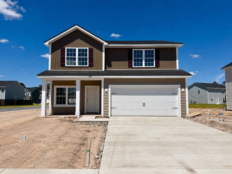 Front exterior of a new home in Grand Reserve, Hinesville, GA, highlighting curb appeal (Image 1). Front exterior of a new home in Grand Reserve, Hinesville, GA, highlighting curb appeal (Image 1).