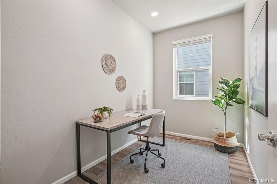 Furnished interior view inside a new home in Woodrose at Painted Prairie, Aurora (Image 9).