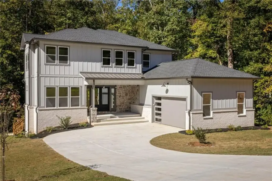 Front exterior of a new home in , Snellville, GA, highlighting curb appeal (Image 2). Front exterior of a new home in , Snellville, GA, highlighting curb appeal (Image 2).