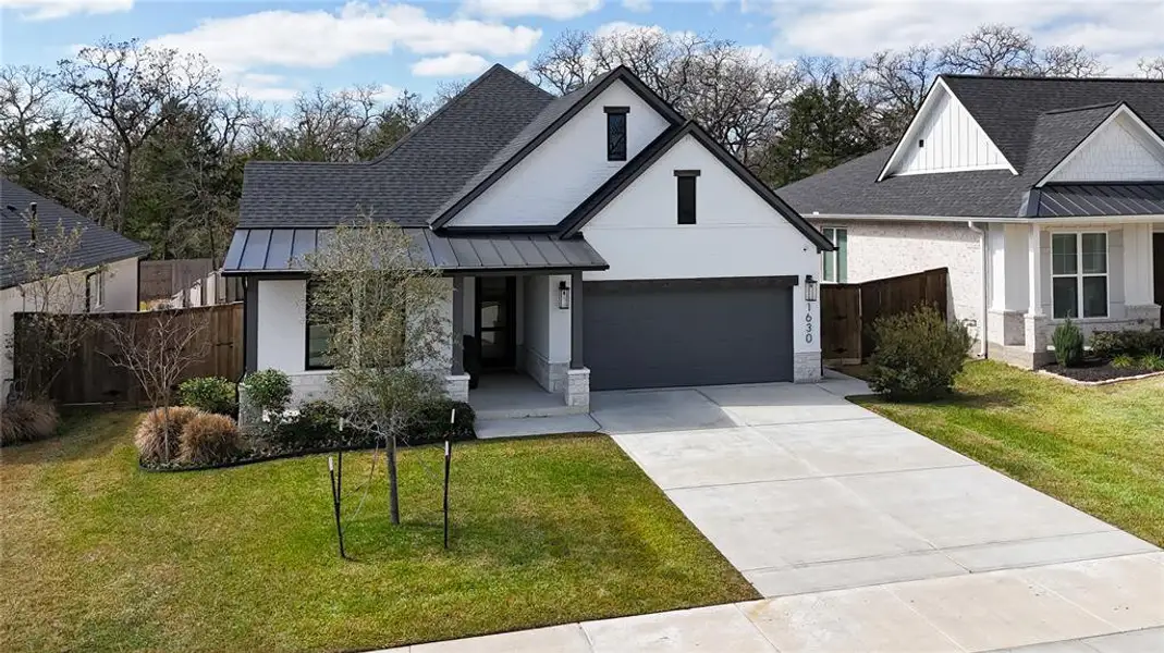 Front exterior of a new home in , College Station, TX, highlighting curb appeal (Image 22).