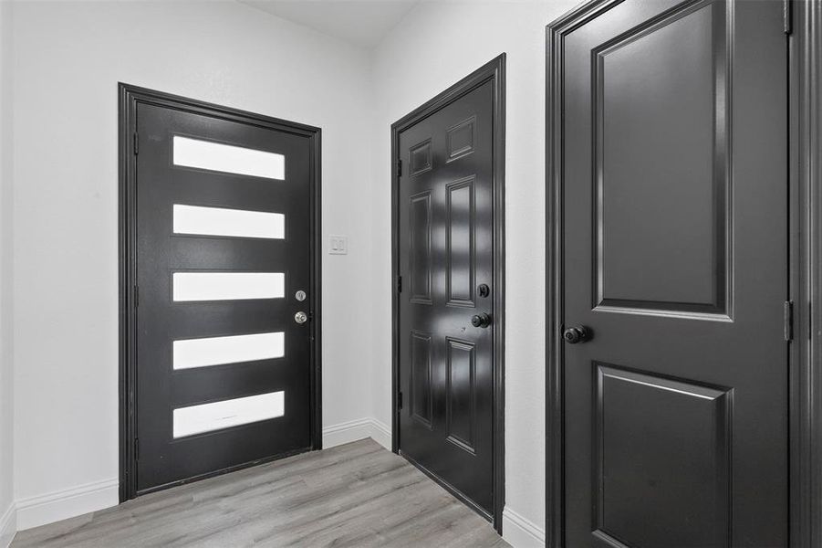 Foyer with light wood-type flooring