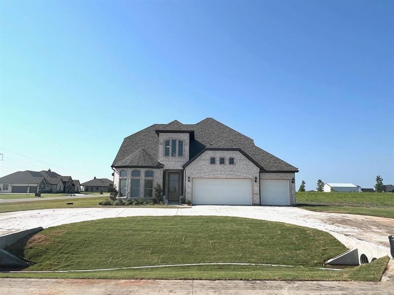 Front exterior of a new home in Providence Point, Nevada, TX, highlighting curb appeal (Image 1). Front exterior of a new home in Providence Point, Nevada, TX, highlighting curb appeal (Image 1).