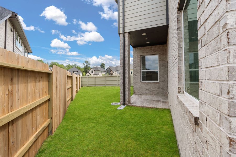 Exterior details and patio area of a home in Evergreen, Conroe (Image 16). Exterior details and patio area of a home in Evergreen, Conroe (Image 16).