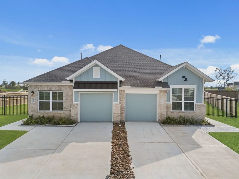 Representative exterior photo of a completed home built from the Chalet by Chesmar Homes in Meridiana Townhomes, Iowa Colony, TX (Image 25).