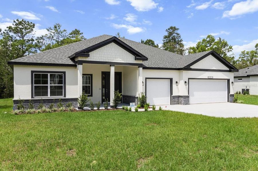 Front exterior of a new home in , Ocala, FL, highlighting curb appeal (Image 24).