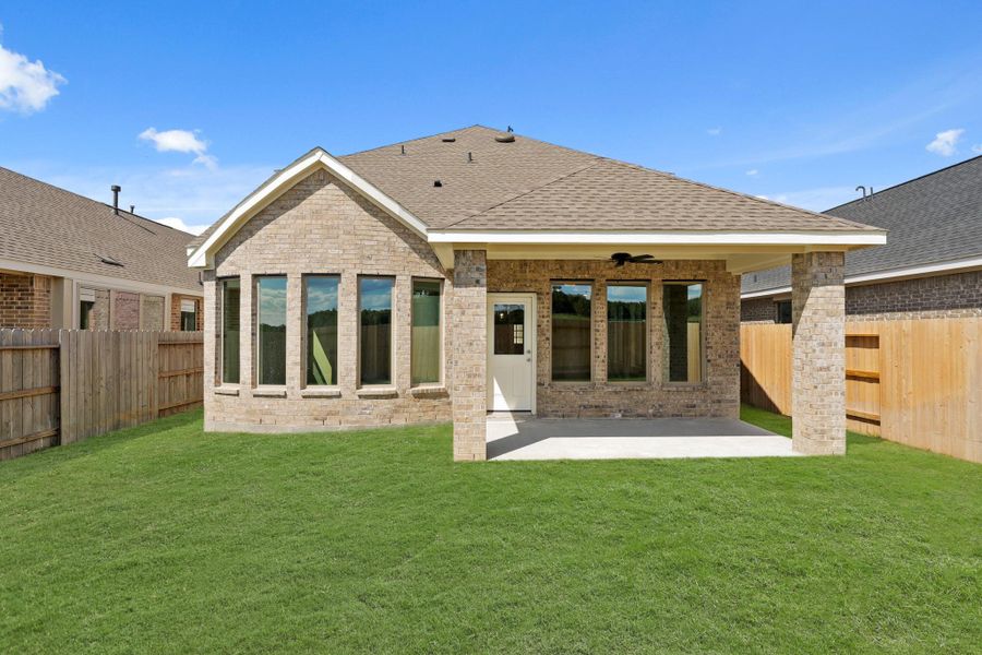 Exterior details and patio area of a home in The Trails, New Caney (Image 3).