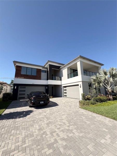 Front exterior of a new home in , Boca Raton, FL, highlighting curb appeal (Image 24). Front exterior of a new home in , Boca Raton, FL, highlighting curb appeal (Image 24).