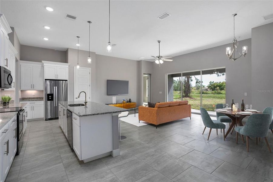 Open concept great room w/ a light and bright kitchen.