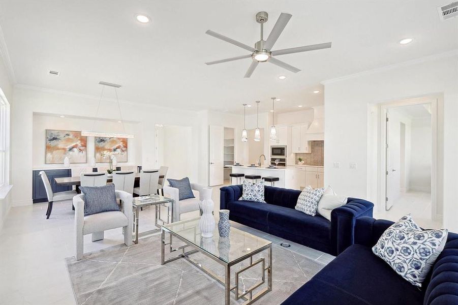 Tiled living room featuring crown molding and ceiling fan