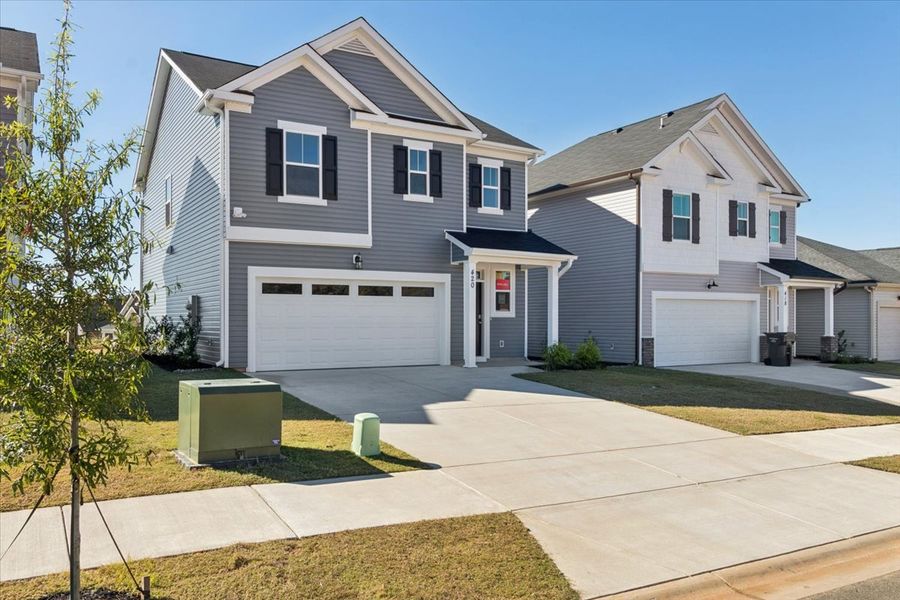 Front exterior of a new home in Windsor, North Augusta, SC, highlighting curb appeal (Image 19). Front exterior of a new home in Windsor, North Augusta, SC, highlighting curb appeal (Image 19).