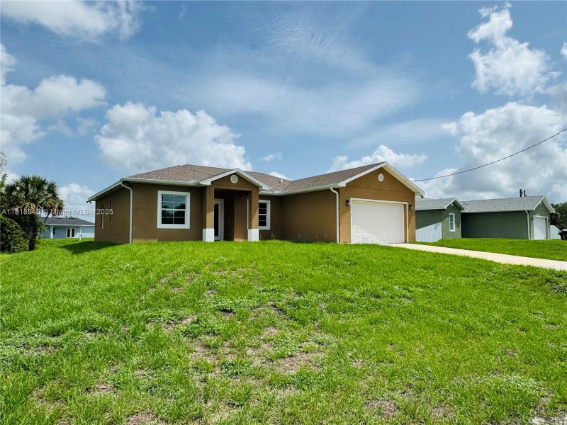 Front exterior of a new home in , Labelle, FL, highlighting curb appeal (Image 2).
